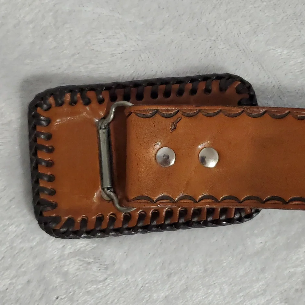 Vintage Leather Belt With Eagle Buckle and Details Embossed Along the Strap.